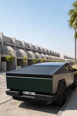 a car parked in front of a building at New Family Villa with PS5, Garden and Playroom in Dubai