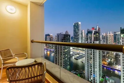 a balcony with a view of a city skyline at 2BR Marina View - Beach Access - Sleeps 8 in JBR in Dubai