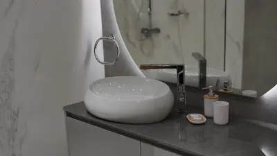 a bathroom with a white bowl sink on a counter at 2 Bedroom beach front apartment in Dubai
