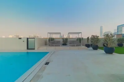 a swimming pool on the roof of a building at Casa Azure in Dubai