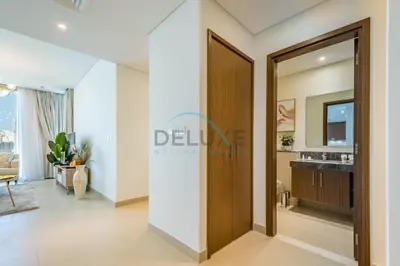 a living room with a door leading to a bathroom at Sea View 3BR with Assistant Room and Balcony, Just Steps from Marina Promenade, 5242 Tower 1, Dubai Marina by Deluxe Holiday Homes in Dubai