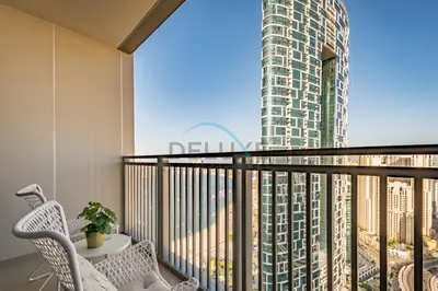 a balcony with a view of a tall building at Sea View 3BR with Assistant Room and Balcony, Just Steps from Marina Promenade, 5242 Tower 1, Dubai Marina by Deluxe Holiday Homes in Dubai