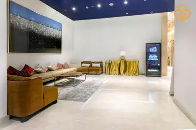 a living room with a couch and a tv at Keysplease 1BR Apartment Damac Maison Prive Business Bay in Dubai