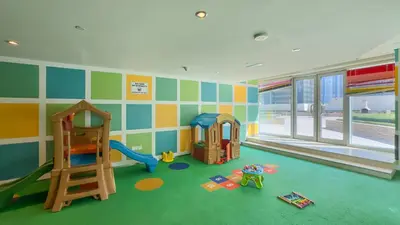 a room with a play area with toys in it at Prime Location - Amazing Burj Khalifa View in Dubai