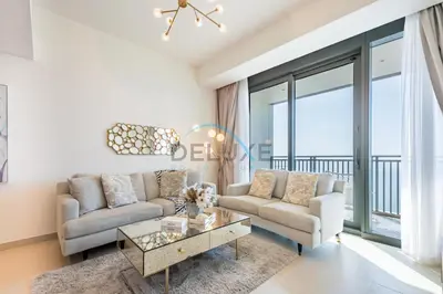 a living room with a couch and a table at Elegant 1BR in 5242 Tower 1, Dubai Marina by Deluxe Holiday Homes in Dubai