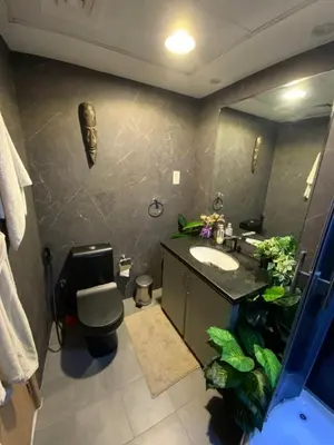 a bathroom with a sink and a toilet and a mirror at Fully upgraded luxurious one bedroom between Marina and JBR in Dubai