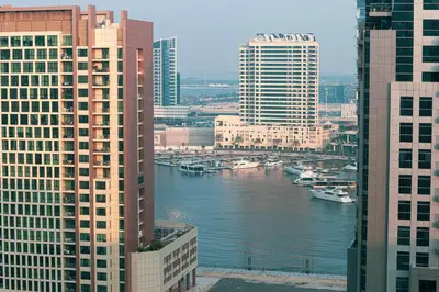 a view of a river in a city with buildings at Outstanding New Studio With 2 Double Beds,In Downtown in Dubai