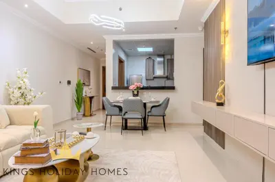 a living room with a couch and a table at Luxury 2 Apartments Dunya tower Burj Khalifa St in Dubai