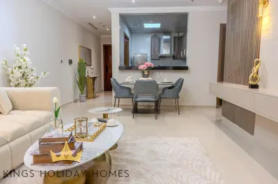 a living room with a couch and a table at Luxury 2 Apartments Dunya tower Burj Khalifa St in Dubai
