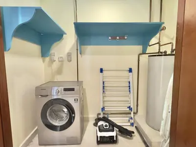 a laundry room with a washing machine in it at Modern Apartment in Dubai Marina in Dubai