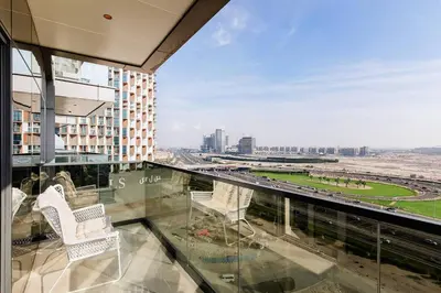 a balcony with two chairs and a view of a city at 10 Mins to Dubai Mall1BRBusiness Bay Heaven in Dubai