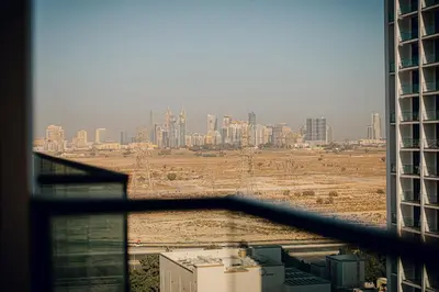 a view of a city from a window of a building at 1BR Cozy and NEW brand JVC in Dubai