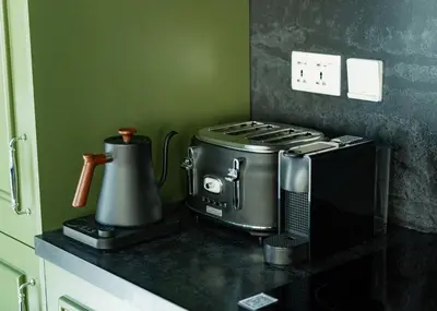 a kitchen counter with a toaster and a microwave at Unique JBR Gem - Full Sea View - Designer's Choice - 5 min walk from JBR Beach in Dubai