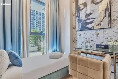 a hotel room with a bed and a window at bnbmehomes - Oxford Terraces in Dubai