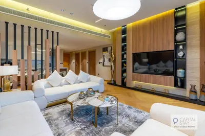 a living room with white couches and a tv at Luxury Beachfront 3 Bed Apt in Dubai JBR in Dubai