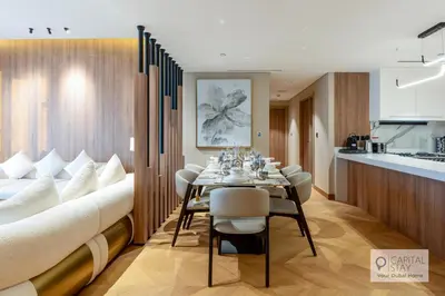 a dining room with a long table and chairs at Luxury Beachfront 3 Bed Apt in Dubai JBR in Dubai