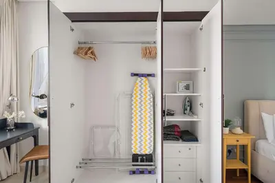 a closet with a tie in a bedroom at Silkhaus Cozy Studio at Sky Gardens-Heart of DIFC in Dubai