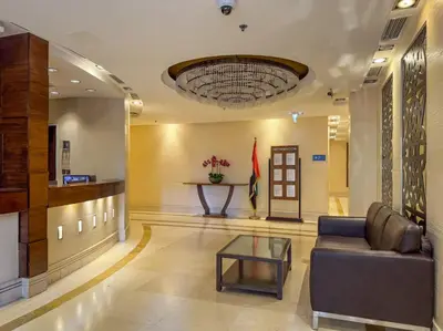 a lobby with a couch and a table in a building at WonderfulStay At JBR - Luxury Dubai Eye View Living - Beach Access - Brand New Luxury Apartments in Dubai