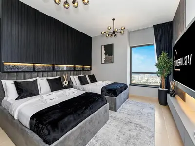 a bedroom with two beds and a large window at WonderfulStay At JBR - Luxury Dubai Eye View Living - Beach Access - Brand New Luxury Apartments in Dubai