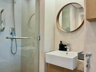 a bathroom with a sink and a shower with a mirror at Boutique Studio in Palm Jumeirah - Stunning View in Dubai