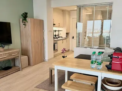 a living room with a table with water bottles on it at Boutique Studio in Palm Jumeirah - Stunning View in Dubai