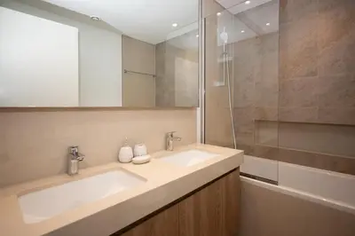 a bathroom with a sink and a shower at Apartment in Downtown Dubai in Dubai