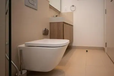 a bathroom with a white toilet in a room at Apartment in Downtown Dubai in Dubai