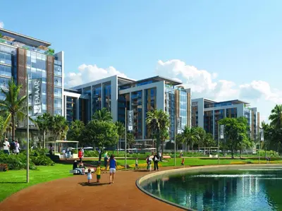 a group of people in a park with buildings at Tranquil 1 Bedroom Dubai Hills Escape in Dubai