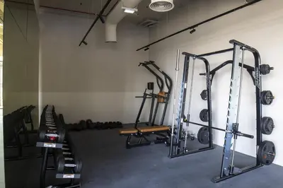a gym with several tread machines in a room at Modern Studio, Burj Views - Business Travelers in Dubai