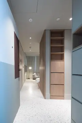 a hallway with a living room with a closet at Modern Studio, Burj Views - Business Travelers in Dubai