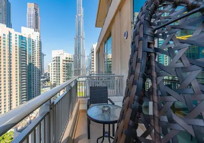 a balcony with a table and a view of the city at Luxurious one bedroom Apartment with Burj Khalifa View in Dubai