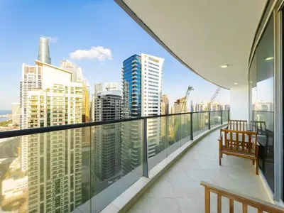 a balcony with benches and a view of the city at SettlerHomes - FIRST CLASS JBR Stay On High-Floor in Dubai