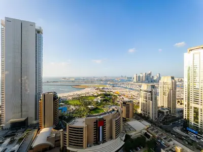 an aerial view of a city with tall buildings at SettlerHomes - FIRST CLASS JBR Stay On High-Floor in Dubai