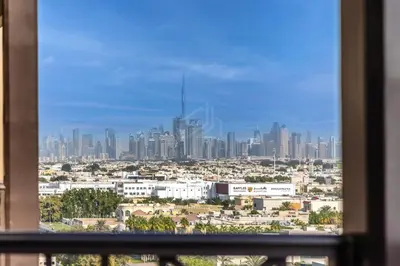 a view of a city skyline from a window at New 1 BD in Madinat Jumeirah Living in Dubai