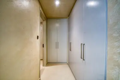 a room with white cabinets and a hallway at Dubai dream villa Emaar in Dubai