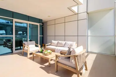 a living room with a couch and chairs and a table at Frank Porter - Zen Tower in Dubai