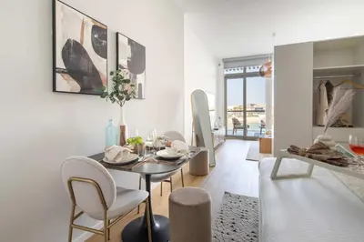 a dining room with a table and chairs at Frank Porter - Palm Views East in Dubai