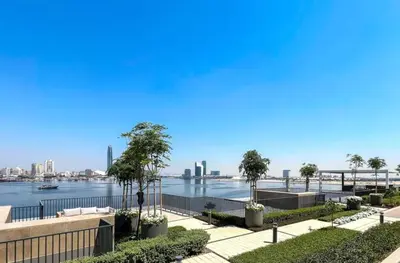 a view of a river with a city in the background at Serene 2BDR with Beach Scenery In Creek Edge- Creek Harbour in Dubai
