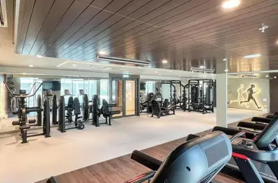 a gym with treadmills and cardio equipment in a building at Serene 2BDR with Beach Scenery In Creek Edge- Creek Harbour in Dubai