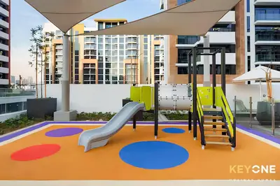 a playground with a slide in a building at Azizi Riviera Studio with Chic Furnishing in Dubai