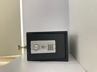 a microwave oven sitting on the floor next to a door at Rimal 2 JBR Studio 70m2 beach, gym, pool in Dubai