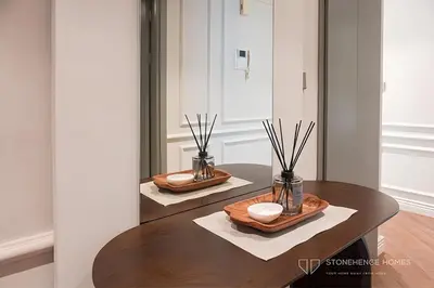 a table with two bowls and a mirror in a room at Chic 1 Bedroom Apartment in Dubai Marina, Marina View, Near JBR in Dubai