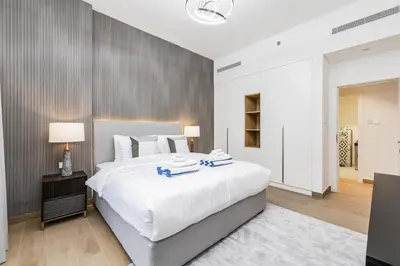 a large bedroom with a large white bed at Luxury lifestyle at La Sirene Port de la Mer Jumeirah 1 in Dubai