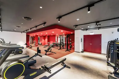 a gym with several treadmills and cardio equipment at Luxury lifestyle at La Sirene Port de la Mer Jumeirah 1 in Dubai