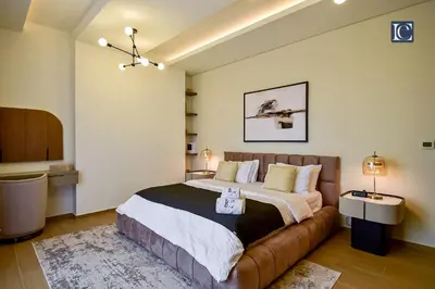 a bedroom with a large bed in a room at Luxury Escapes - Luxurious 2-Bedroom Apartment with Stunning Lake Views in JBR in Dubai