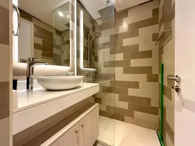 a bathroom with a sink and a mirror at Studio Apartment in Seven Palm with Beach Access in Dubai