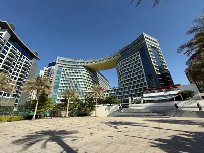 a group of tall buildings in a city at Studio Apartment in Seven Palm with Beach Access in Dubai