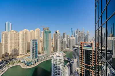 a view of a city with a river and buildings at The Signature in Dubai