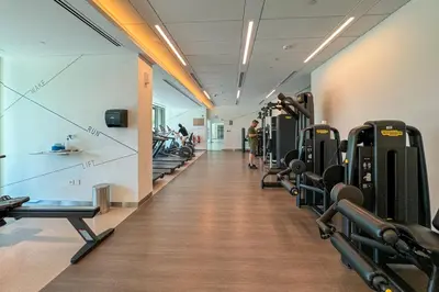 a gym with treadmills and machines in a room at Luxury 1 Bedroom in the Heart of Famous Downtown in Dubai