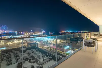 a view of a city at night from a building at Frank Porter - Sunrise Tower in Dubai
